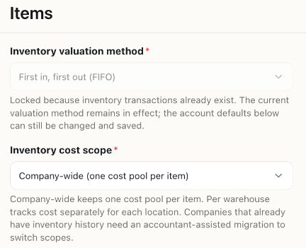 Items settings showing the locked FIFO method, Company-wide cost scope, and the explanation of warehouse cost pools.